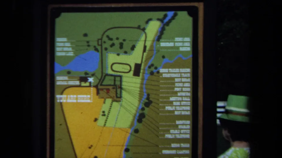 Another 1971 California 8mm view of the park map sign, showing labeled facilities, paths, water shapes, and dark scan edges.
