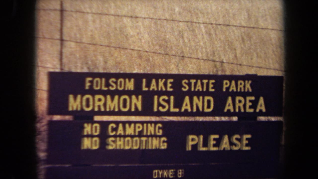 Folsom Lake State Park Mormon Island Area sign with no camping and no shooting notices.