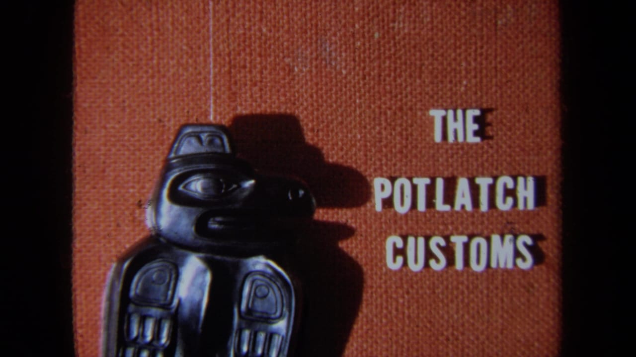 Dark carved totem-style figure beside white text reading The Potlatch Customs on an orange-brown backdrop.