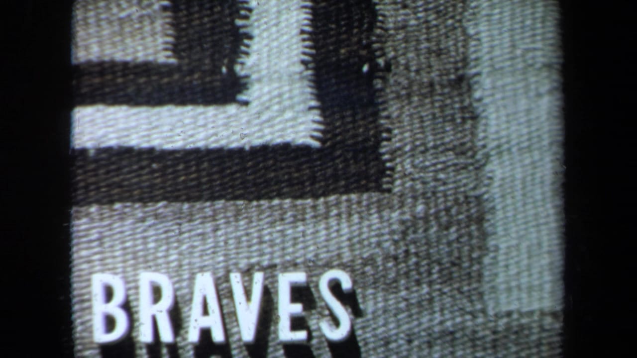 1971 California 8mm frame showing the word “BRAVES” over a textured black-and-white geometric title-card design.