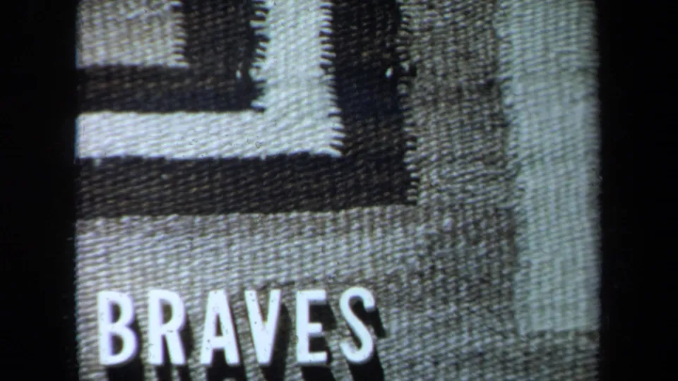 1971 California 8mm frame showing the word “BRAVES” over a textured black-and-white geometric title-card design.