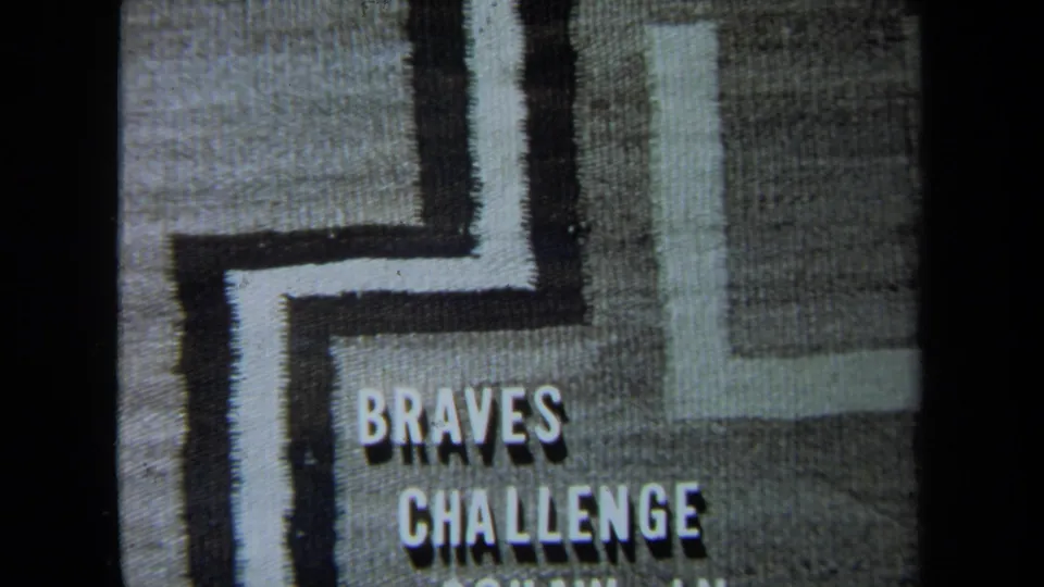 1971 California 8mm frame showing “BRAVES CHALLENGE” on a textured title card with partial lower lettering.