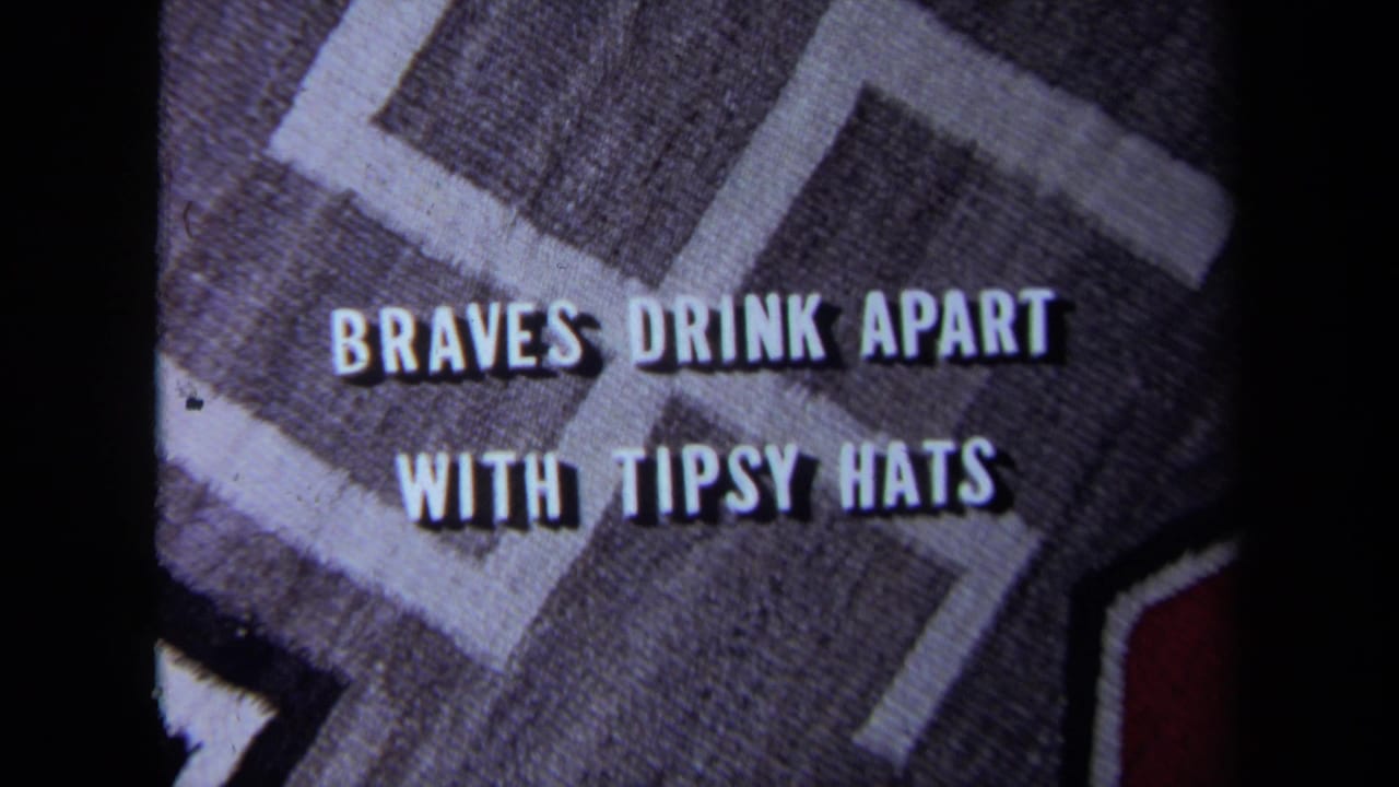 Second title card frame with the same phrase on a patterned cloth background.