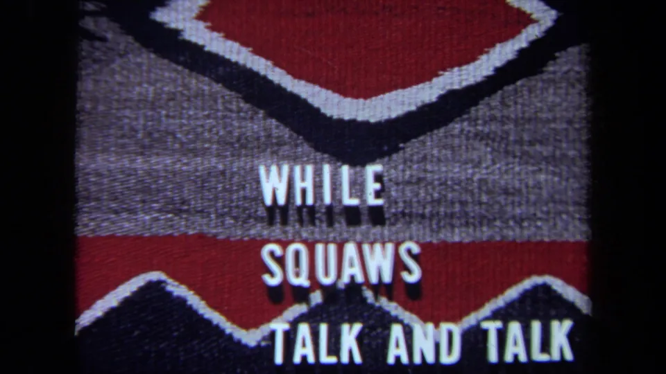 1971 California 8mm frame with centered white lettering over a red, black, and gray woven pattern and visible film edge.
