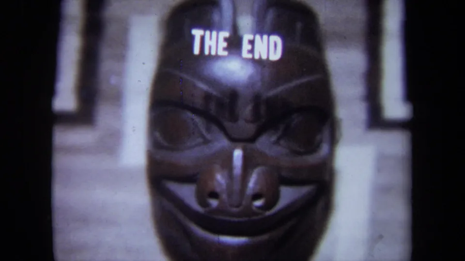 1971 California 8mm frame with a carved mask centered below the THE END ending title.