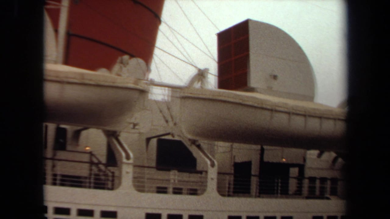 Ocean liner deck with lifeboat, davits, railings, radar dome, and funnel section.