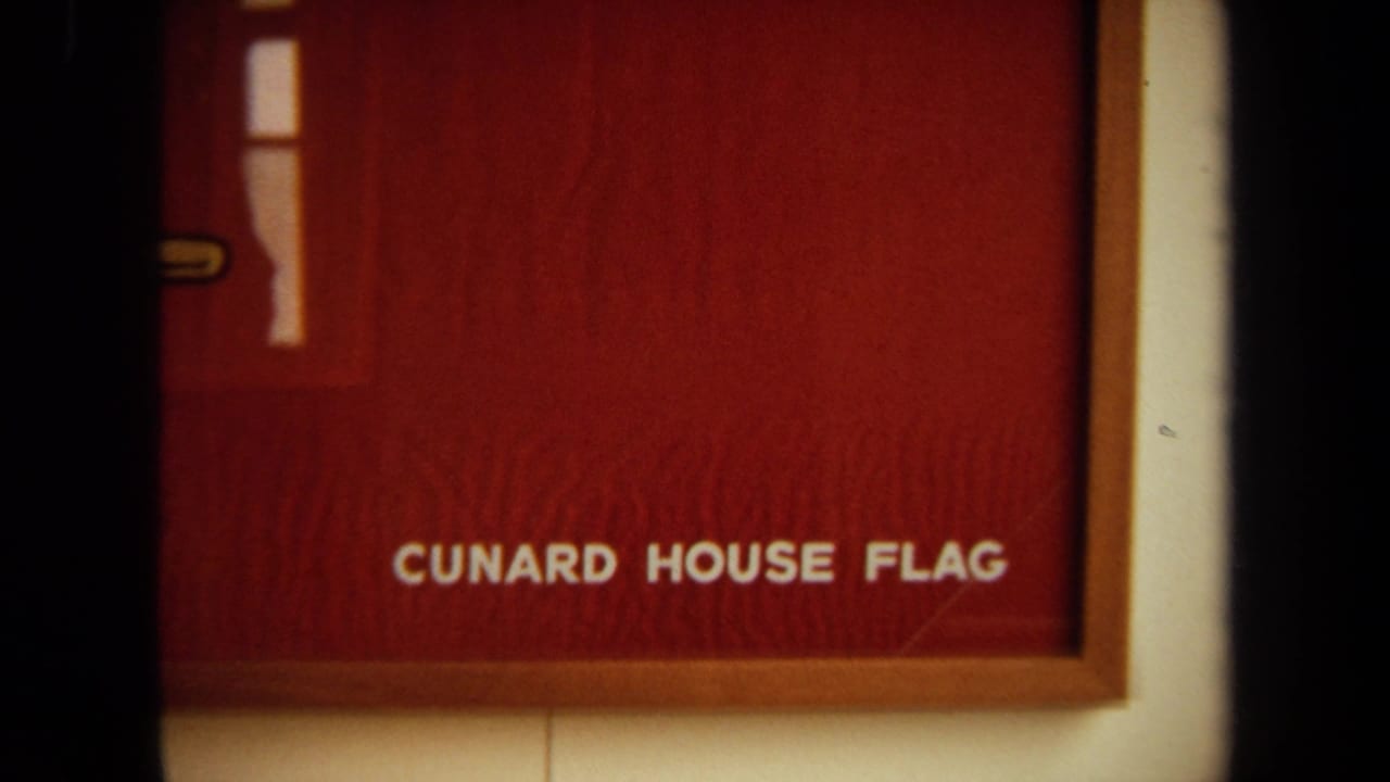 Red title card or display reading Cunard House Flag.