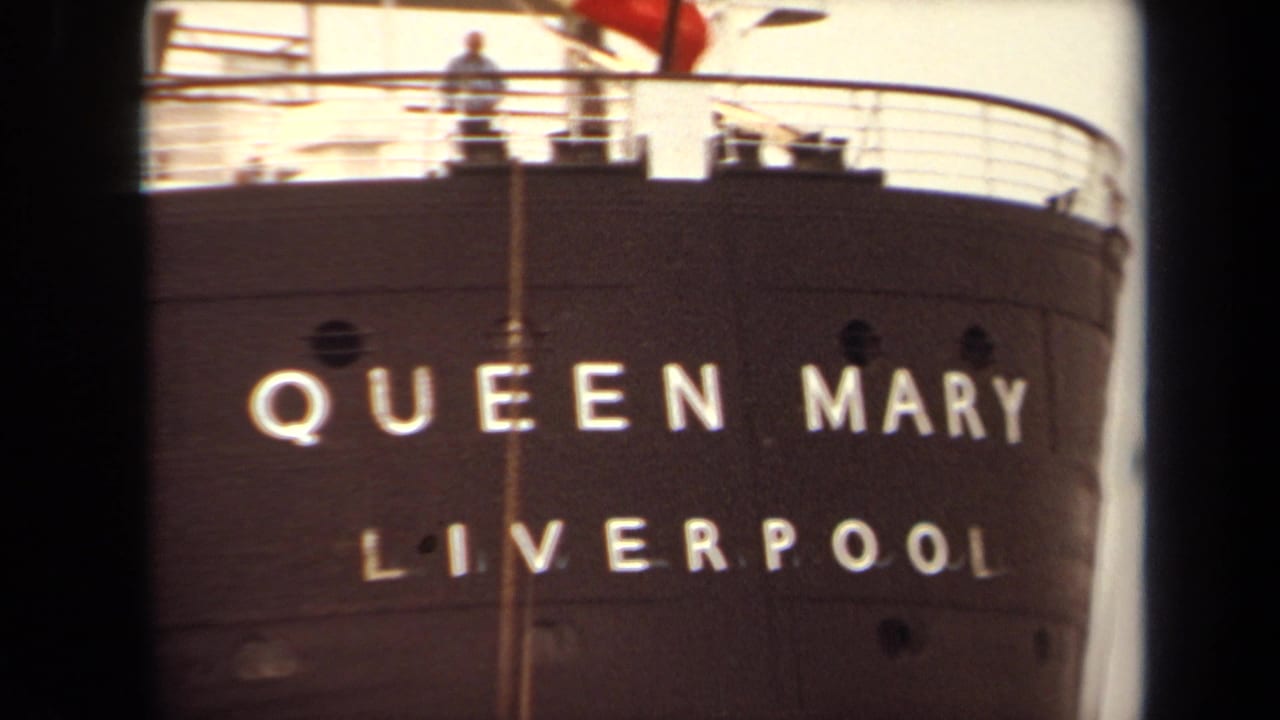 Queen Mary bow lettering fills the frame with railings and a small figure on deck.
