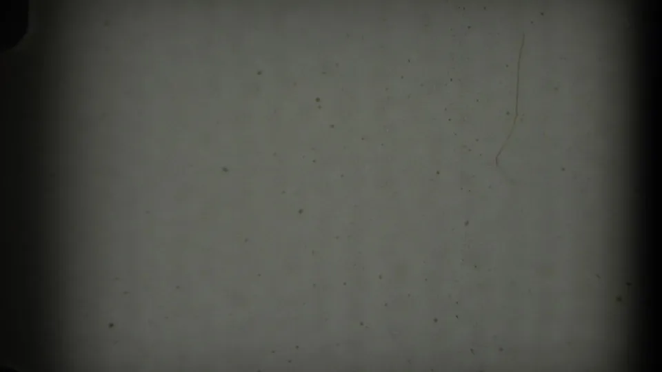 Final 1971 Long Beach clip frame appears blank or leader-like, preserving dust, scratches, and 8mm border artifacts.