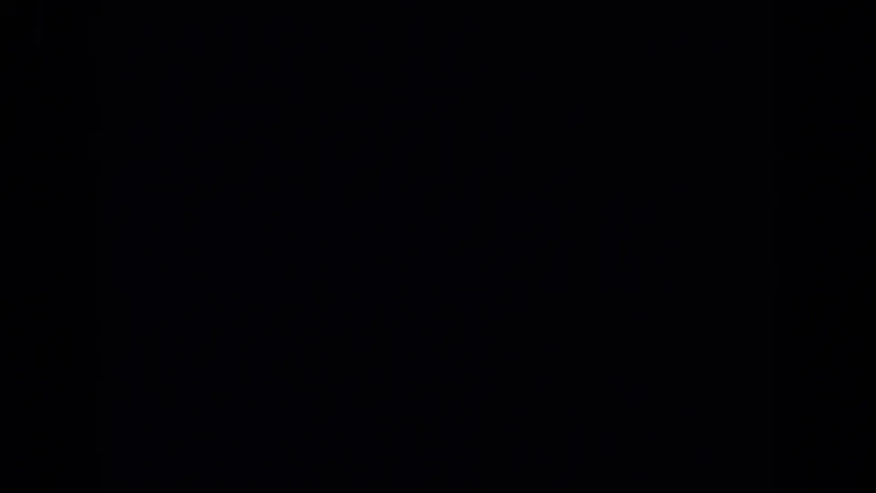 A mostly dark 1971 Maine 8mm frame, likely an underexposed or obscured moment before the waterside view becomes clear.
