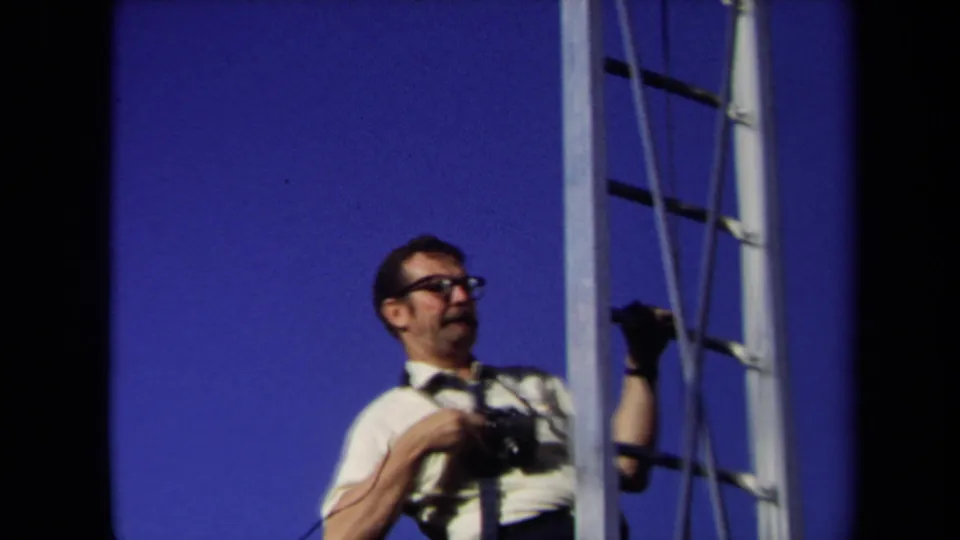 A closer 1971 Sacramento view shows the photographer in glasses and a white shirt holding a camera beside the ladder.