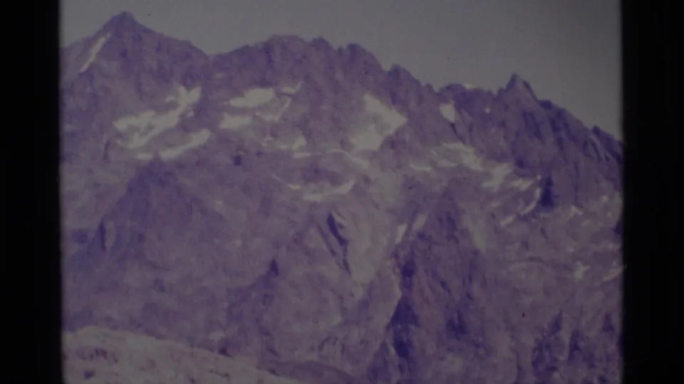 Minaret Wilderness mountain ridge in soft 8mm color, showing steep rock faces and lingering snow.