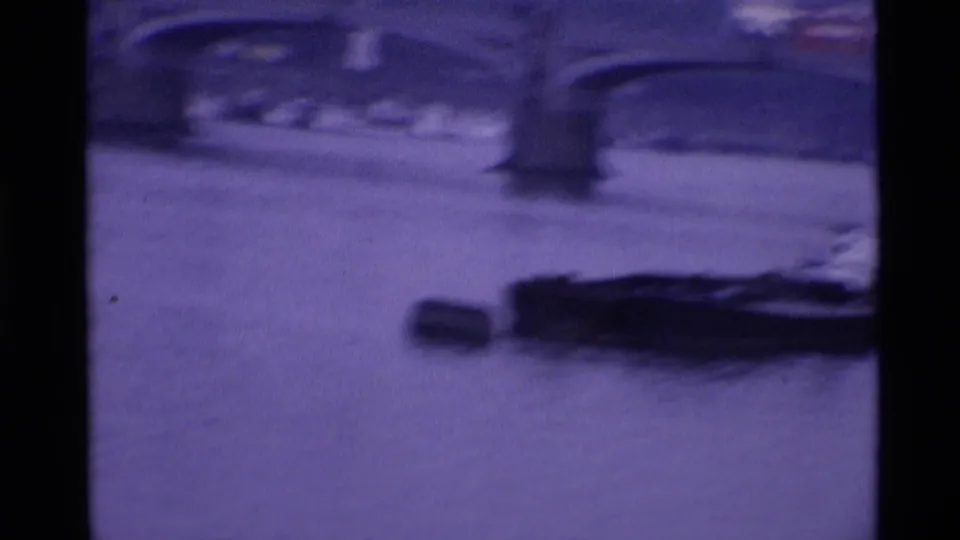 A London bridge view over water appears in a soft purple 8mm frame, with a dark boat shape below.