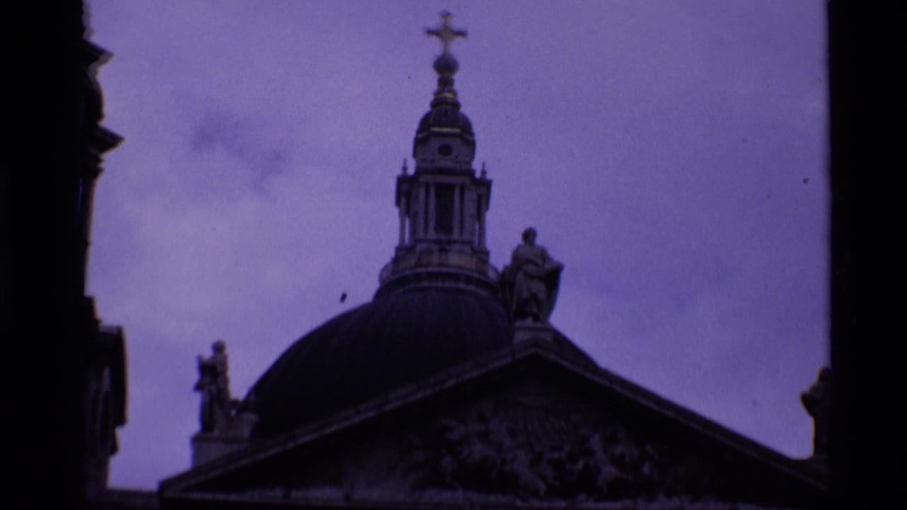 St Paul's Cathedral in London appears in a twilight 8mm frame, with the dome, lantern, statues, and pediment partly visible.