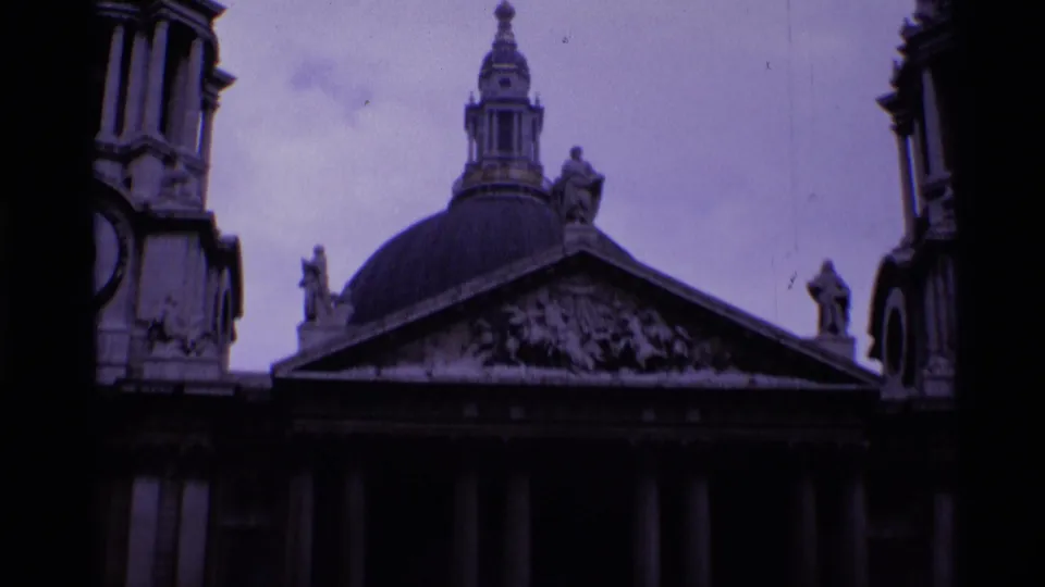 A wider 1969 8mm view of St Paul's Cathedral shows the dome, classical facade, columns, statues, and flanking tower forms.