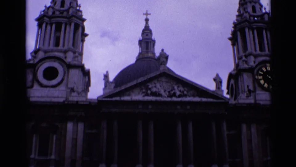 St Paul's Cathedral in London fills the frame in 1969 home-movie footage, with dome, towers, columns, statues, and a visible clock.