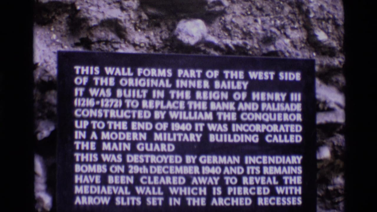1969 London 8mm frame showing a Tower of London historical plaque about the west side of the original Inner Bailey.