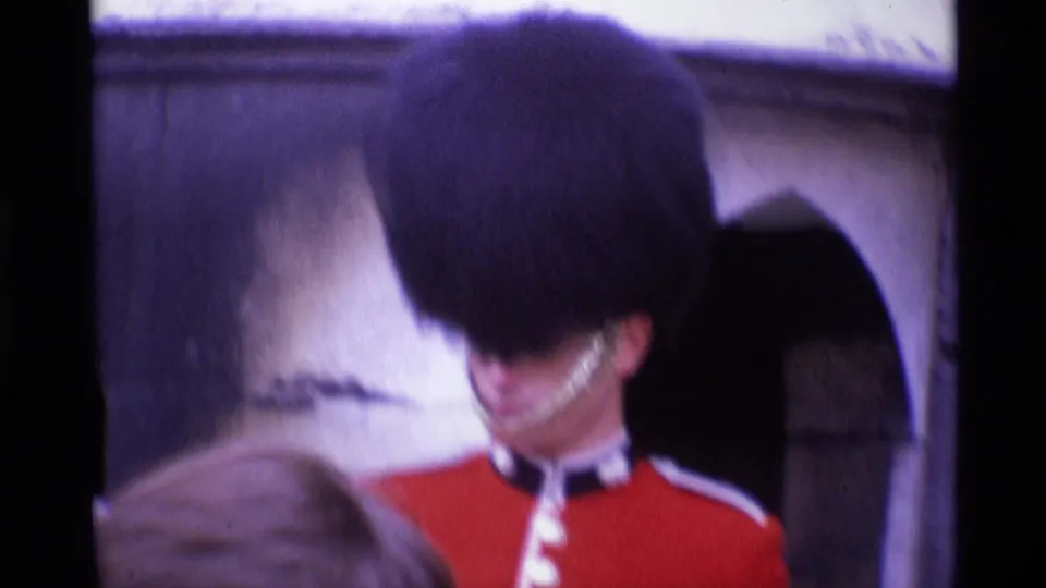 Closer 1969 London home-movie view of the guard, with a visitor's head partially obscuring the lower frame.