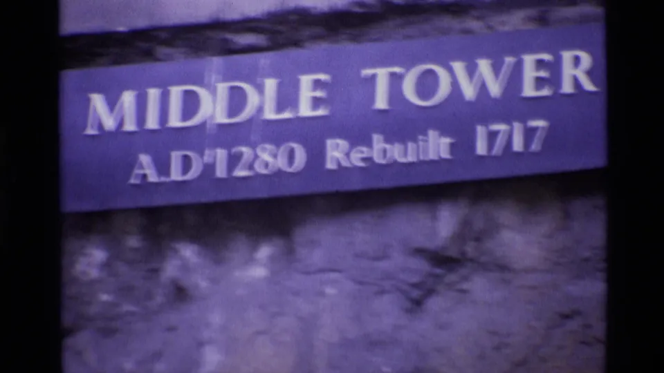 Middle Tower sign in London, reading A.D. 1280 and rebuilt 1717, filmed on 8mm in 1969.