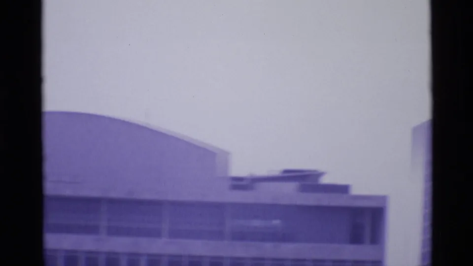 1969 London frame with the Royal Festival Hall area appearing as a broad curved roof and adjoining modernist facade.
