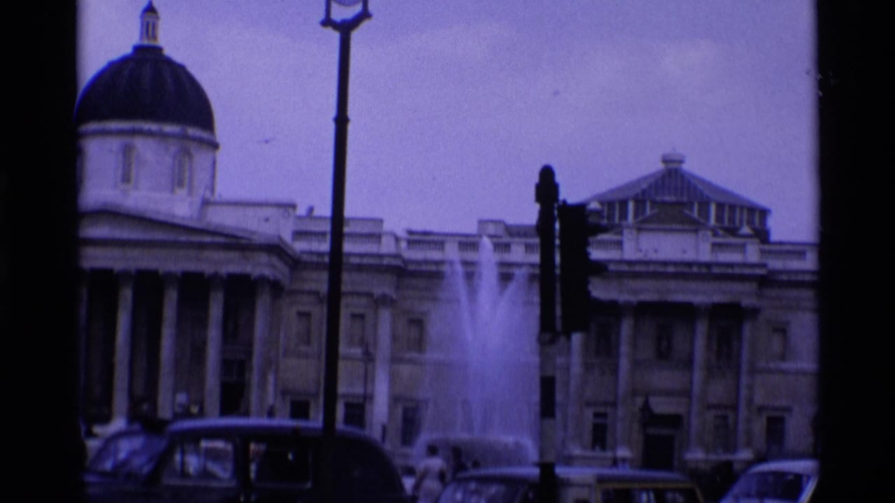 Trafalgar Square in London, 1969, with the National Gallery, fountain spray, street lights, and period cars.
