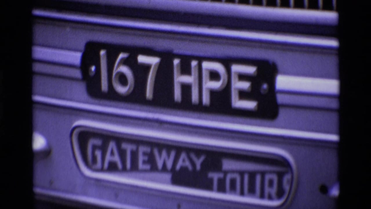 Close view of a bus side panel with "167 HPE" and "GATEWAY TOURS" signage.