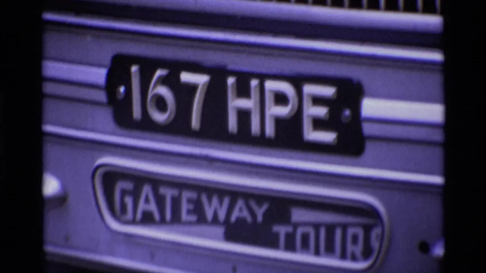 Close 1969 London bus detail showing the "167 HPE" plate and "GATEWAY TOURS" sign on a vehicle side panel.