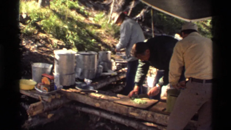 The final frame shows 1972 campsite food preparation in Montana, with men working near cookware, a tarp, and leafy terrain.