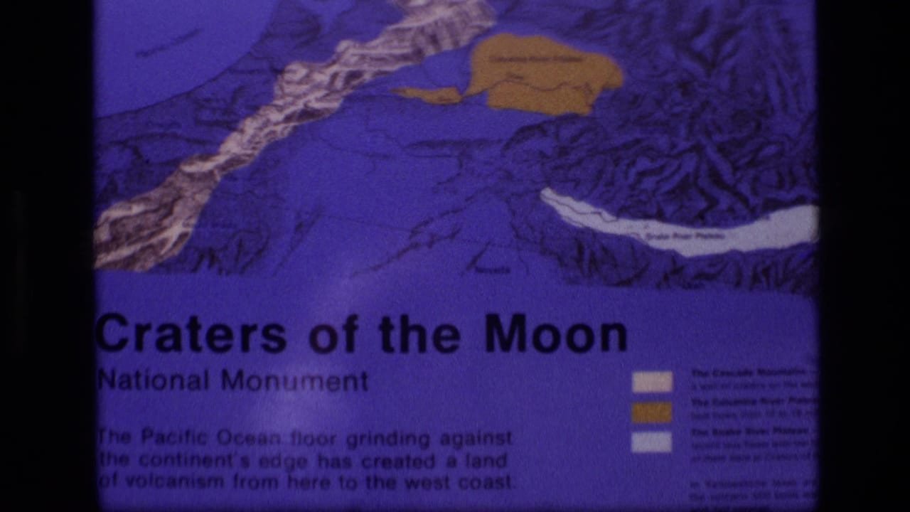 Second 1972 Idaho frame of the Craters of the Moon display, showing the sign title, map colors, and soft 8mm exposure.
