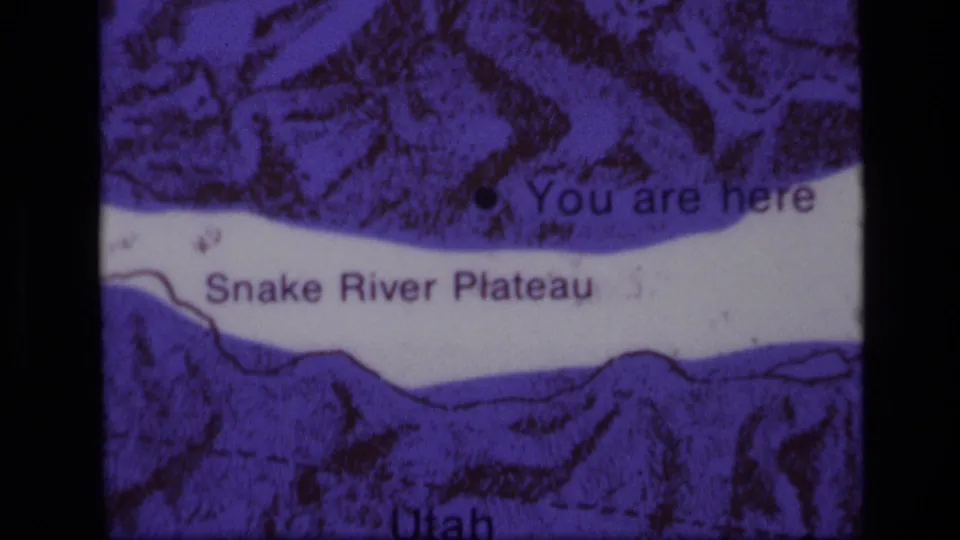 Tight 1972 8mm frame of the Snake River Plateau map label with You are here text and Utah visible near the bottom.