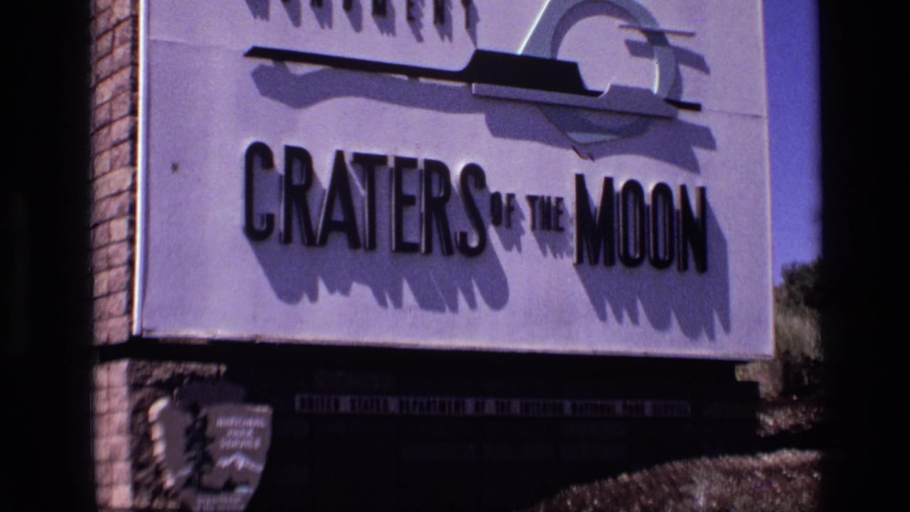 Close view of the Craters of the Moon sign with dark film-frame edges.