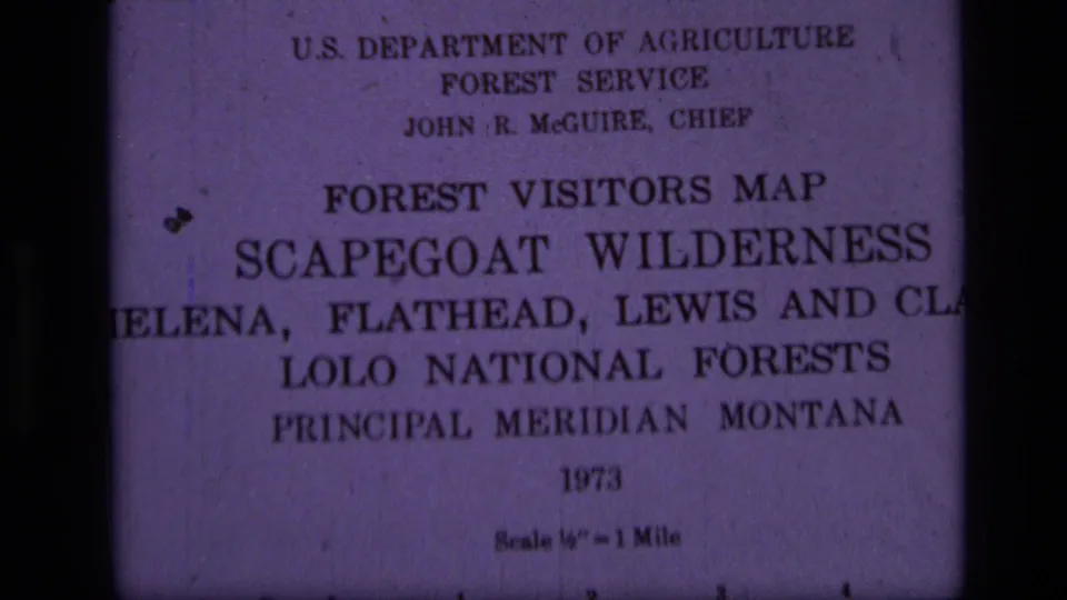 Slightly shifted close view of the 1973 Forest Service Scapegoat Wilderness visitors map with purple film cast and soft focus.