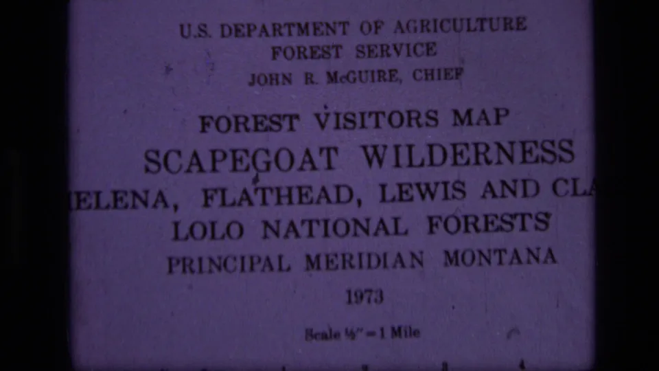 1973 USDA Forest Service visitor map title page for Scapegoat Wilderness in Montana, filmed close up on 8mm.