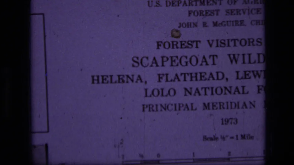 Partial close-up of the 1973 Scapegoat Wilderness visitor map title page, cropped by handheld framing.