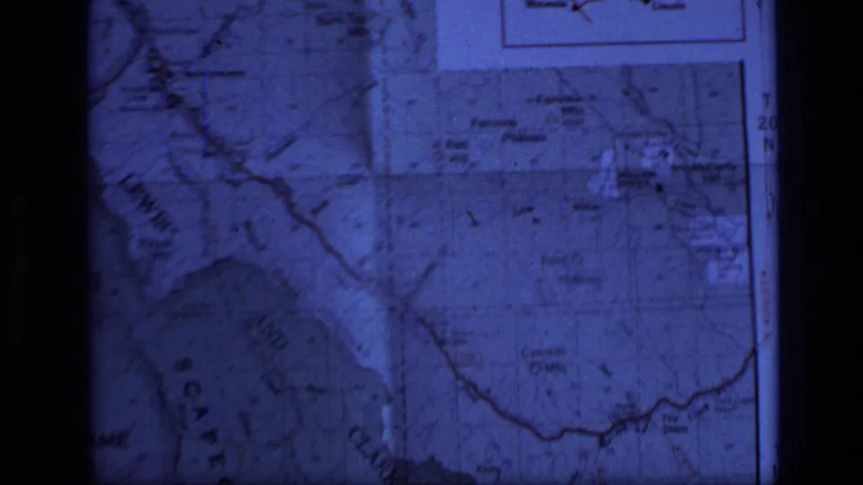 Blue 8mm frame of a Montana map showing the Scapegoat Wilderness region, river lines, boundary markings, and printed inset panels.
