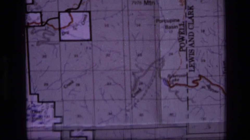 Close 1973 8mm frame of a Scapegoat Wilderness area map showing contours, creeks, basin labels, and boundary markings.