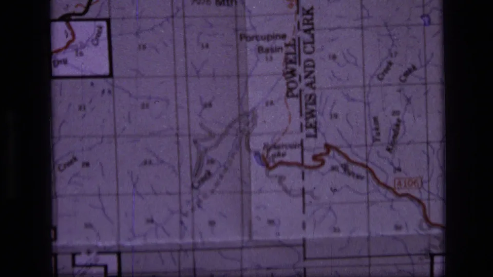Close 8mm frame of the Montana wilderness map, including the Powell Lewis and Clark boundary label and nearby terrain markings.