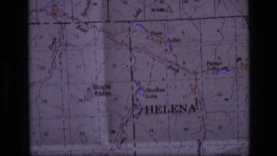 1973 home-movie map insert showing Helena, nearby terrain labels, and visible 8mm frame edges.