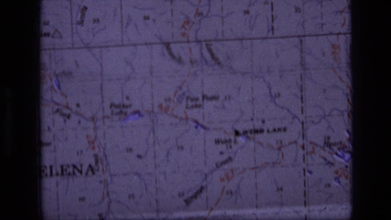 1973 8mm frame showing a Scapegoat Wilderness, Montana topographic map with Webb Lake, Heart Lake, trails, and grid lines.