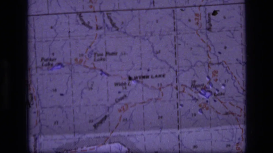 Final 1973 8mm map frame showing the Scapegoat Wilderness area with Webb Lake, Heart Lake, route lines, and visible film borders.