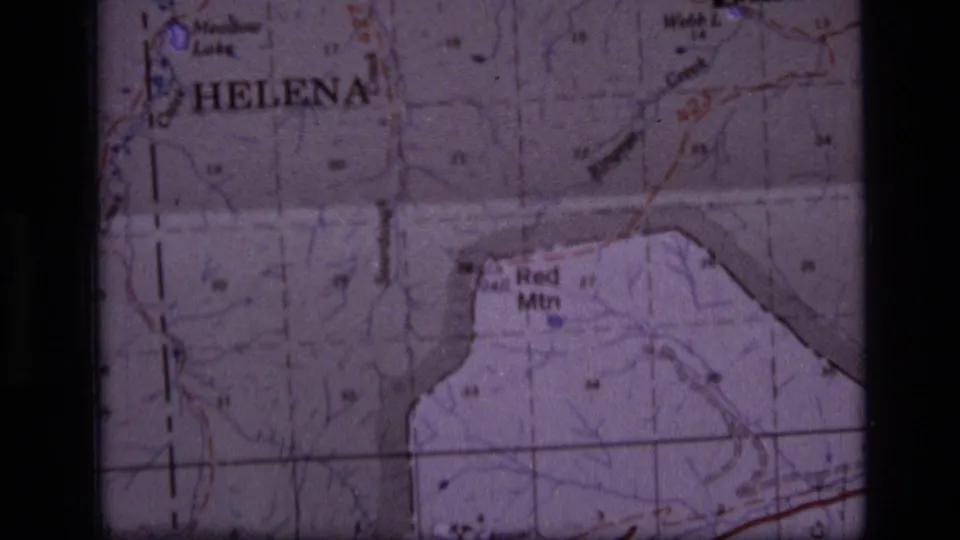 Final 1973 8mm map frame showing Helena, Webb Lake, and Red Mtn labels with soft focus, grain, and dark film borders.