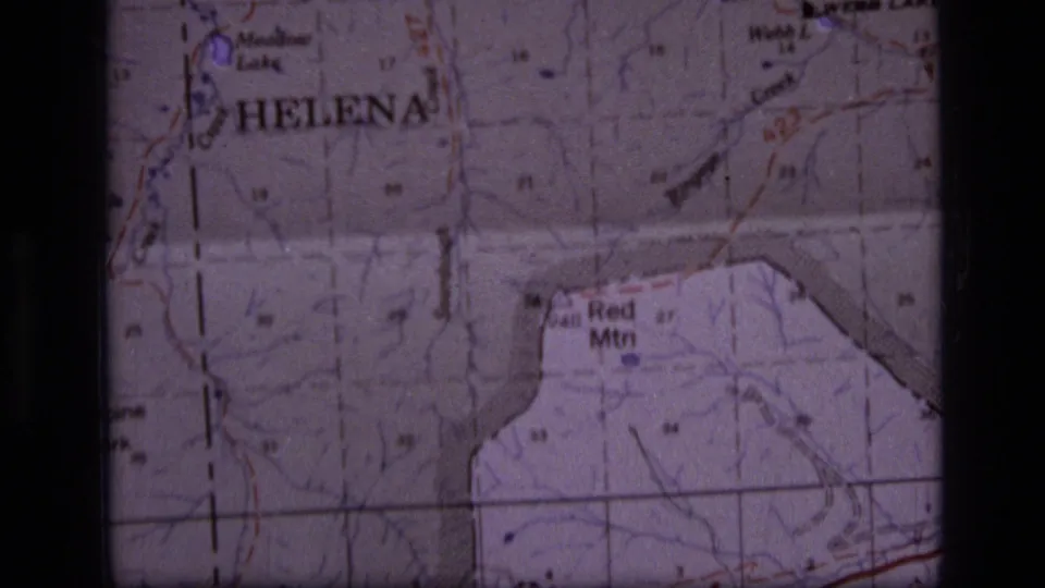 1973 8mm close-up of a Montana topographic map with Helena, Red Mtn, Webb Lake, grid lines, and soft film borders visible.
