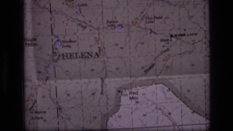 Final 8mm contact-sheet frame of the Montana map, showing Helena, Red Mtn, Webb Lake, printed terrain markings, and dark scan borders.