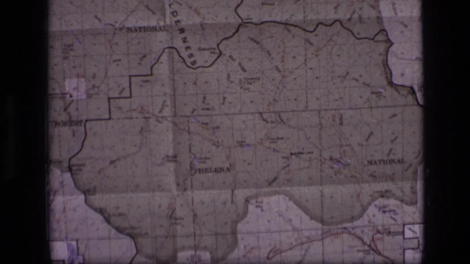 Final 1973 8mm frame shows a wider Montana map view with Helena, national forest markings, fold lines, and soft faded color.