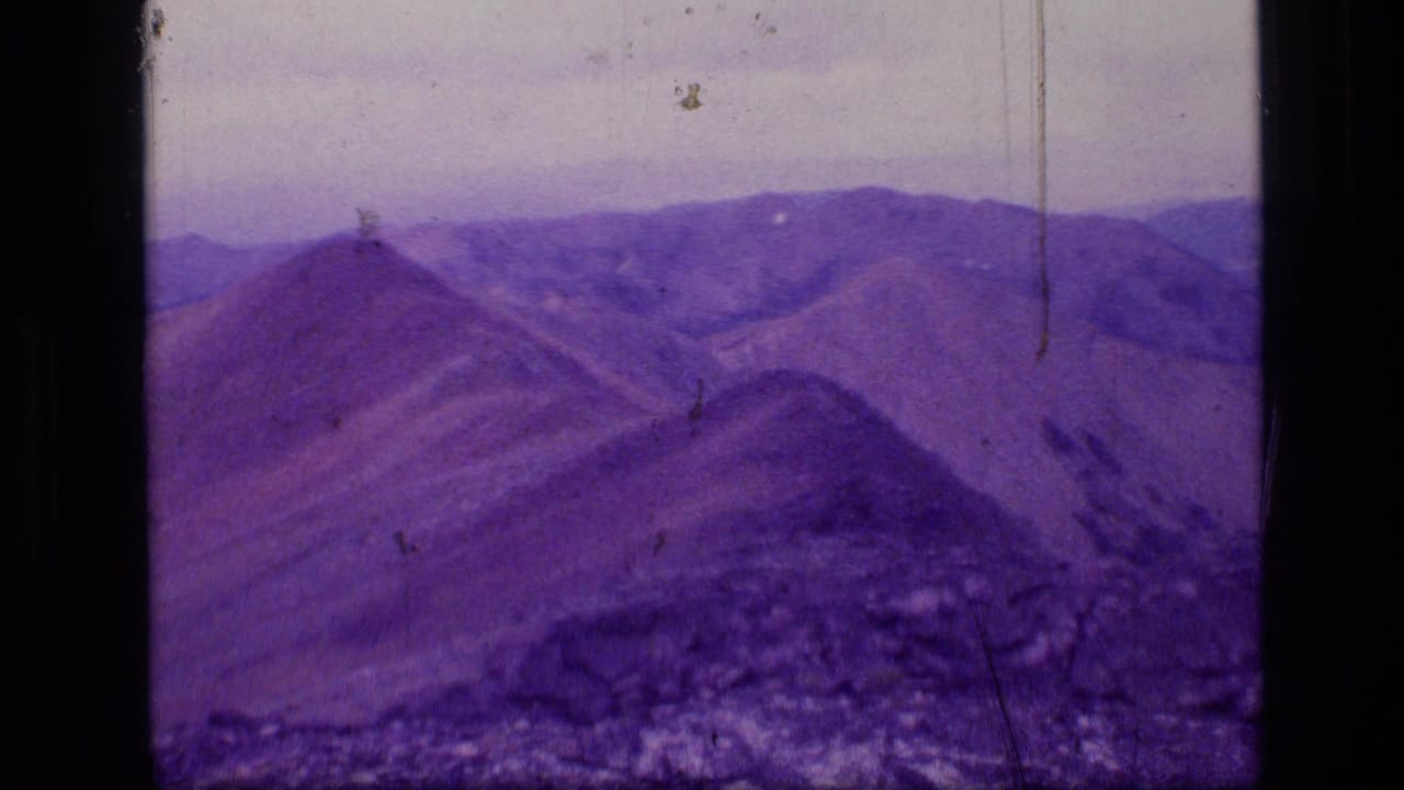 Panoramic 8mm frame of the Scapegoat Wilderness, Montana, showing distant ridges and rocky high-country terrain.