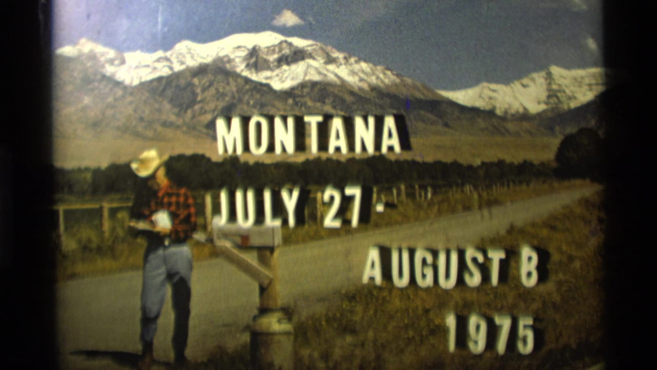 Man in cowboy hat standing by a mailbox with Montana travel title text and mountains behind him.