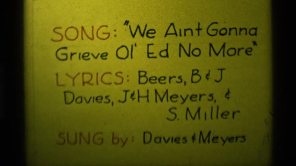 Yellow 8mm title card from Agate Springs, Montana, listing the song title, lyric contributors, and Davies & Meyers as singers.
