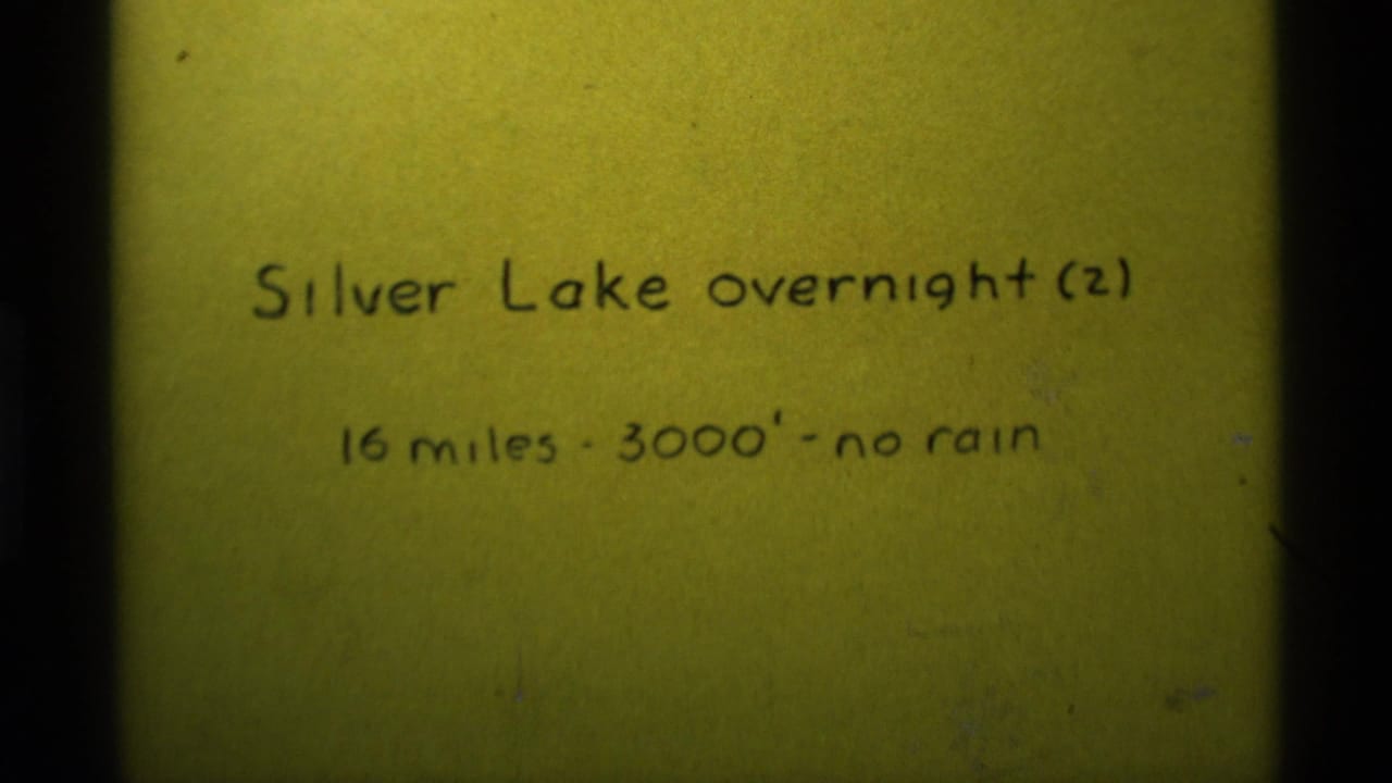 1975 8mm-style title card for a Silver Lake overnight hike with mileage, elevation, and weather notes.