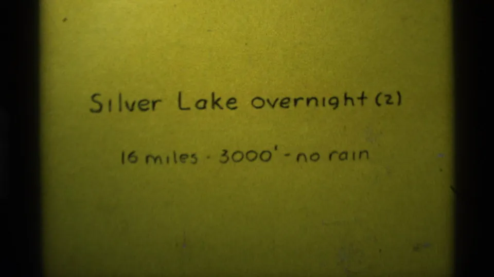 1975 8mm-style title card for a Silver Lake overnight hike with mileage, elevation, and weather notes.