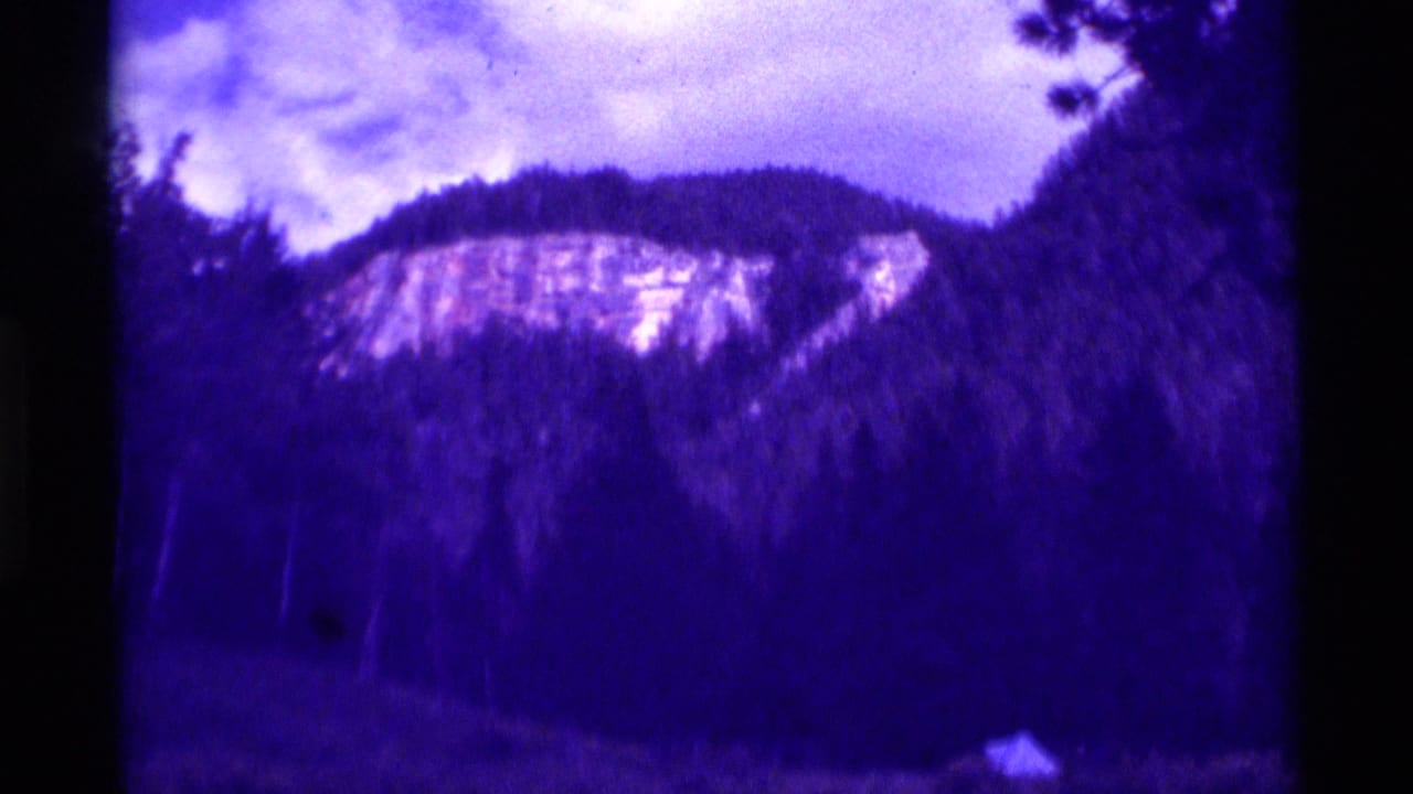 Agate Springs landscape frame with wooded slopes, a light cliff band, cloudy sky, and heavy 8mm color shift.